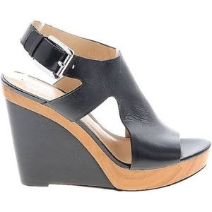 Pair of Size 9 Michael Kors black and brown wedges. Gently used